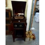 A Fullotone wind-up gramophone in a mahogany cabinet incorporating an old valve radio. WE DO NOT