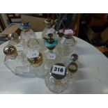 11 English cut-glass and silver scent bottles, late Victorian and later, including four sprays (