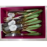 A quantity of Norwegian 925 silver-gilt and green enamel dessert cutlery, 10.2 ozt excluding