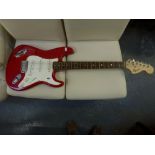 A Fender Squire Strat electric guitar in red with soft case WE DO NOT TAKE CREDIT CARDS OR CASH.