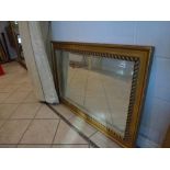 Two decorative rectangular gilt framed bevel edged mirrors, one with rope decoration WE DO NOT