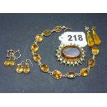 A Victorian citrine bracelet, mounted in gold, tests as 8/9 ct; a citrine, pearl and emerald brooch,