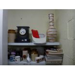 Two mixed shelves including a Victorian black slate mantel clock, stoneware storage jars and hot