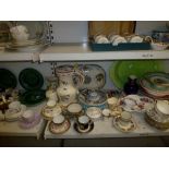 Two and a half shelves of assorted 19th century and later china including cabinet cups and