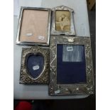 Three Edwardian ornate silver-faced photograph frames, the largest in Art Nouveau style, 12 in,