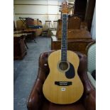 A Kona acoustic guitar model K394D with soft case WE DO NOT TAKE CREDIT CARDS OR CASH. STORAGE IS
