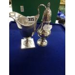 A George III silver helmet milk jug and baluster muffineer, London 1793 and 1780, 6.1 ozt WE DO