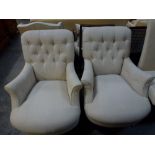 A good pair of modern reproduction armchairs in the style of Howard with buttoned backs on