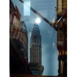 A framed coloured photographic print of The Waldorf Astoria and the Empire State Building (74 x 50