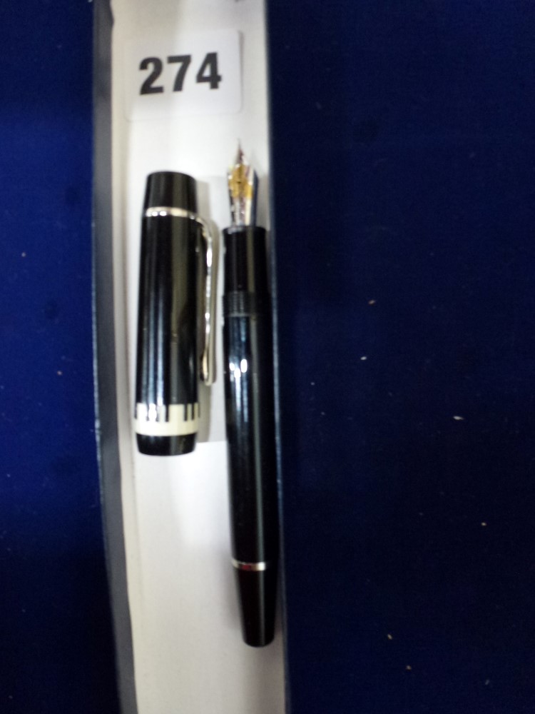 A Montblanc von Karajan black lacquered fountain pen with 18 carat gold nib numbered 4810, the lid