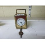 A small vintage carriage timepiece, probably French, in a plain brass case [B] WE DO NOT TAKE CREDIT