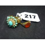 A 1930s fire opal ring, in 18 ct gold and platinum; and a large dress ring in turquoise, split