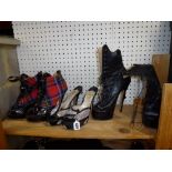 Terry de Havilland: two pairs of platform lace-up ankle boots, in black leather and tartan, and a
