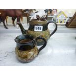 A Royal Doulton stoneware teapot, decorated with a band of fish and bubbles, the lid with signed