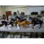 Five large Beswick horses including 'The Winner' no.2421, unglazed Black Beauty, two brown horses in