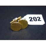 A pair of 18 ct gold cufflinks, circular to a spring-loaded T-bar, 9.4 gm gross WE DO NOT TAKE