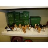 19 Beswick figurines of various dogs including Scottie, Rottweiler, Dachshund, Labrador, Alsatian,