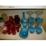 A good collection of mainly coloured glass wares comprising two pairs of blue vases, a pair of