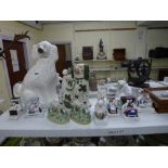 A large Staffordshire fireside dog plus another smaller with green highlights, a pair of