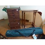 A Victorian mahogany miniature chest of seven graduated drawers, a folding tray-top table, two