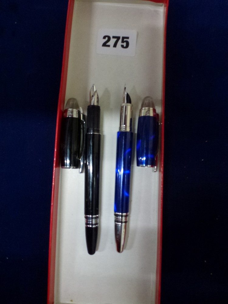 Two Montblanc StarWalker fountain pens each with 14 carat gold nibs one in blue, the other in