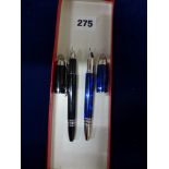 Two Montblanc StarWalker fountain pens each with 14 carat gold nibs one in blue, the other in