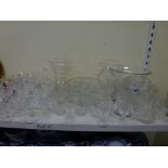 Two shelves of mixed items including a quantity of glassware comprising fruit bowls, wine and sherry