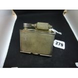 A vintage petrol table lighter by McMurdo, the rectangular body cased in engine-turned silver with