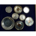 Eight small silver dishes, comprising: Egyptian 900 standard; four small Middle Eastern engraved;