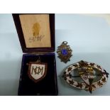 A silver and enamelled fob chain medallion for King's Lynn Hospital and an enamel badge for Queen