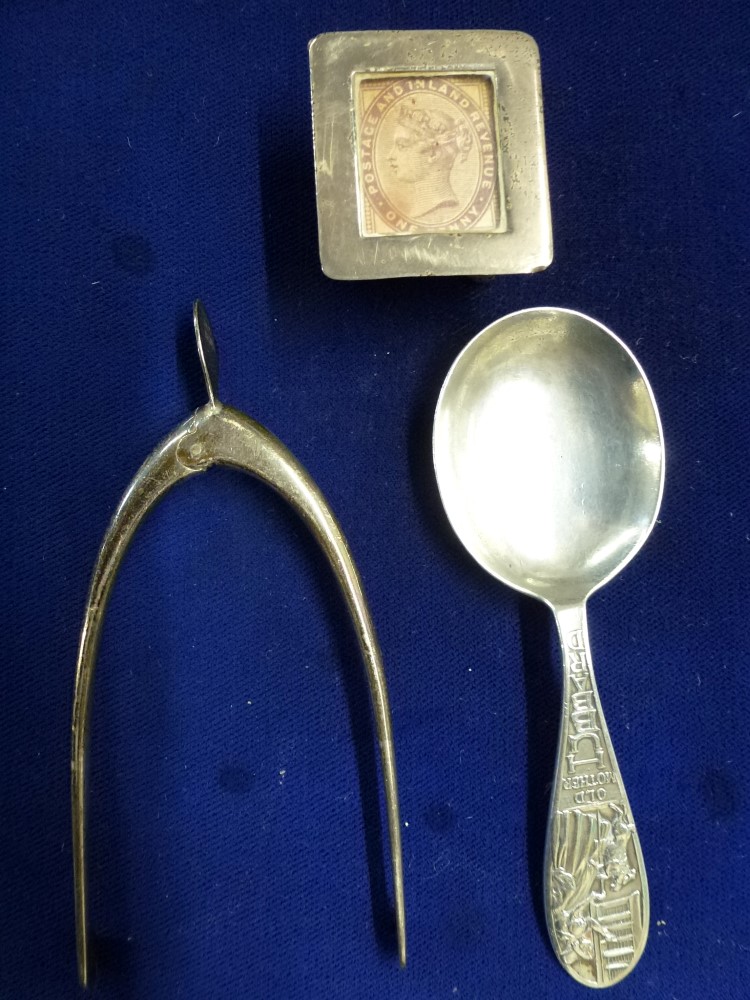 A silver wishbone sugar tongs, Birmingham 1929; a stamp box, Birmingham 1899; and an Old Mother