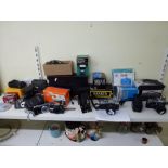 A collection of cameras including a Kodak No 2 Folding Brownie Camera, a Minolta XG-M, A Fujica