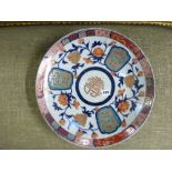 Two large circular Japanese dishes in the Imari colours, a framed photograph, two walking canes