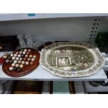 Two shelves of decorative ceramics and other items, including two Johnson Brothers Christmas