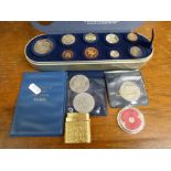 A Royal Mail 2000 Time Capsule of nine mint coins including a £5 coin, three modern commemorative £5