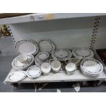 A Royal Doulton dinner and tea service for six in Burgundy pattern, including two covered