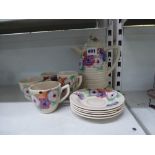 A Clarice Cliff Wilkinson pottery part coffee set, the ribbed grey ground enamelled with pansies,