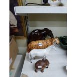 Two gilt framed HMVs His Masters Voice prints, a Beswick tiger, two wooden carved elephants and a