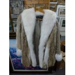 A lady's fox and coyote fur coat with ivory fox fur trim, shawl collar and cuffs, Sebastiano Roma