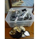 A plastic box full of unused hair slides and pins in horn and a small number of packets of beads. WE