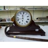 A vintage bulkhead timepiece in brass case, the case now adapted for display on a carved mahogany