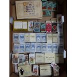 A spectacular collection of 32 full cigarette packets of cigarette cards many filed in original