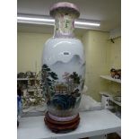 A large modern Chinese famille rose vase painted with a landscape, and another smaller, with