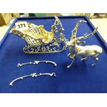 A charming silver sweetmeat basket as a rococo sleigh with gilt interior pulled by a reindeer,