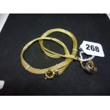 A two-colour three-strand necklace, and a pair of two-colour ear hoops, all stamped 14K, 18.8 gm