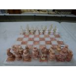 A modern chess set in pink and white stone, with matching board [C] WE DO NOT TAKE CREDIT CARDS OR