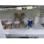 A shelf of interesting ceramics, including two Rockingham trumpet vases with red griffin marks, a