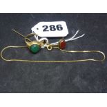 Two 9 ct gold rings set with cabochon green and red stones, together with a 9 ct anklet and stick
