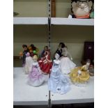 Four Royal Doulton figurines comprising Sweet One HN 1318, Top O'Hill HN 1834, Biddy Penny