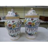 A pair of maiolica drug jars with covers, probably 19th century Italian, inscribed 'VNG.SANTALIN'